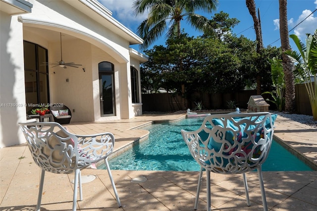 260 NE Wavecrest Ct, Boca Raton, FL 33432 - view of swimming pool with a fenced backyard and a ceiling fan