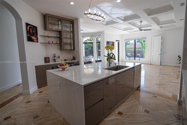 260 NE Wavecrest Ct, Boca Raton, FL 33432 - kitchen with light marble finish flooring, arched walkways, ceiling fan, recessed lighting, and a large island