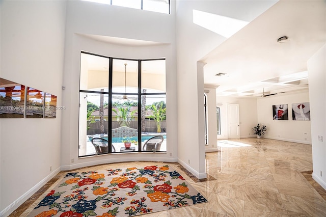 260 NE Wavecrest Ct, Boca Raton, FL 33432 - entryway featuring baseboards and marble finish flooring