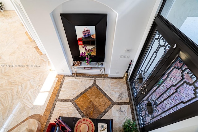 260 NE Wavecrest Ct, Boca Raton, FL 33432 - entryway with inlaid floor details and arched walkways