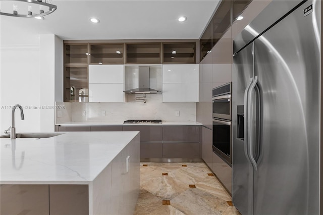 260 NE Wavecrest Ct, Boca Raton, FL 33432 - kitchen featuring wall chimney range hood, a sink, appliances with stainless steel finishes, and modern cabinets