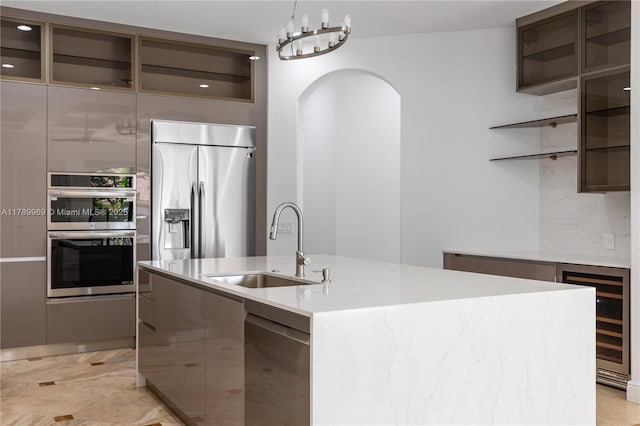 260 NE Wavecrest Ct, Boca Raton, FL 33432 - kitchen with stainless steel appliances, modern cabinets, arched walkways, open shelves, and beverage cooler
