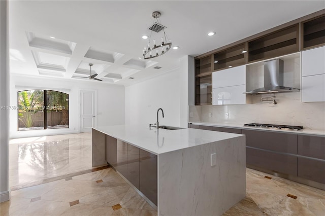 260 NE Wavecrest Ct, Boca Raton, FL 33432 - kitchen featuring modern cabinets, wall chimney range hood, coffered ceiling, tasteful backsplash, and beamed ceiling