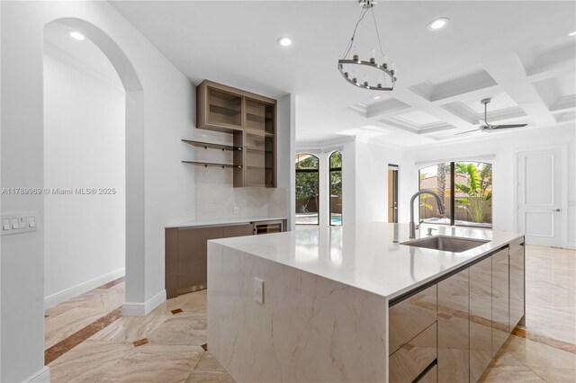 260 NE Wavecrest Ct, Boca Raton, FL 33432 - kitchen featuring modern cabinets, light marble finish flooring, recessed lighting, arched walkways, and a ceiling fan