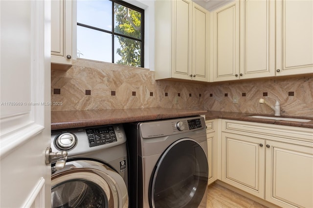 260 NE Wavecrest Ct, Boca Raton, FL 33432 - laundry area featuring cabinet space and washer and clothes dryer