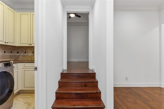 260 NE Wavecrest Ct, Boca Raton, FL 33432 - laundry room featuring cabinet space, washer / dryer, light wood-style floors, ornamental molding, and a ceiling fan