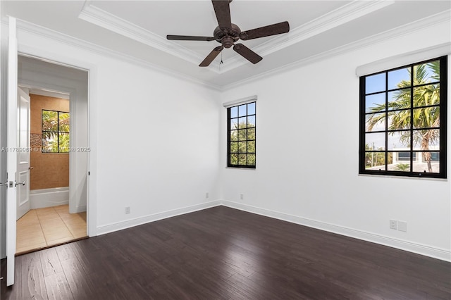 260 NE Wavecrest Ct, Boca Raton, FL 33432 - spare room featuring wood-type flooring, ornamental molding, a ceiling fan, and a tray ceiling