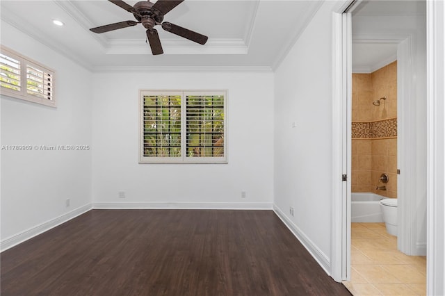 260 NE Wavecrest Ct, Boca Raton, FL 33432 - unfurnished bedroom with wood finished floors, a raised ceiling, crown molding, ensuite bathroom, and a ceiling fan