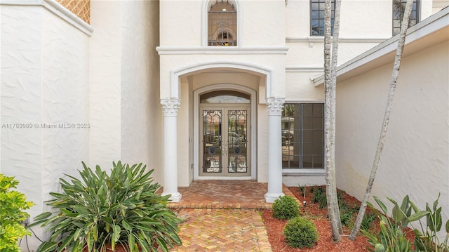 260 NE Wavecrest Ct, Boca Raton, FL 33432 - doorway to property featuring french doors and stucco siding
