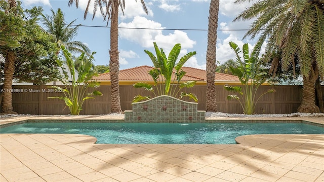 260 NE Wavecrest Ct, Boca Raton, FL 33432 - view of swimming pool featuring a fenced backyard and a patio area