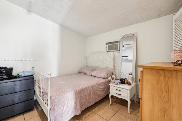 6451 Coolidge St, Hollywood, FL 33024 - bedroom featuring a textured ceiling, a wall mounted AC, and light tile patterned flooring