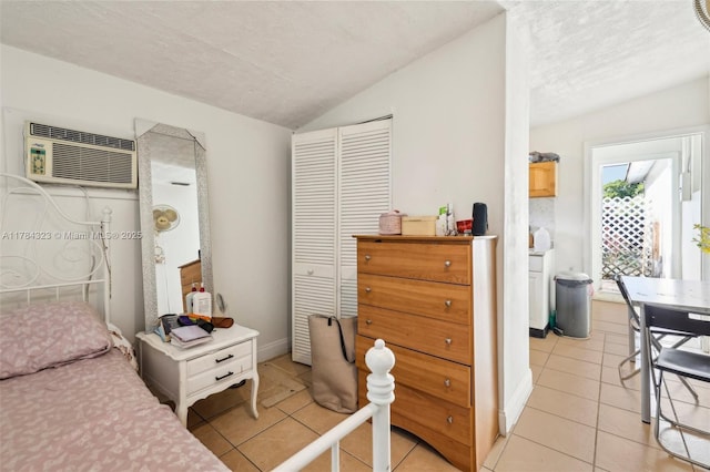 6451 Coolidge St, Hollywood, FL 33024 - bedroom with a textured ceiling, light tile patterned floors, lofted ceiling, and a wall mounted air conditioner
