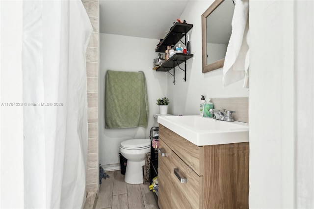 6451 Coolidge St, Hollywood, FL 33024 - full bathroom with vanity, wood finished floors, toilet, and curtained shower