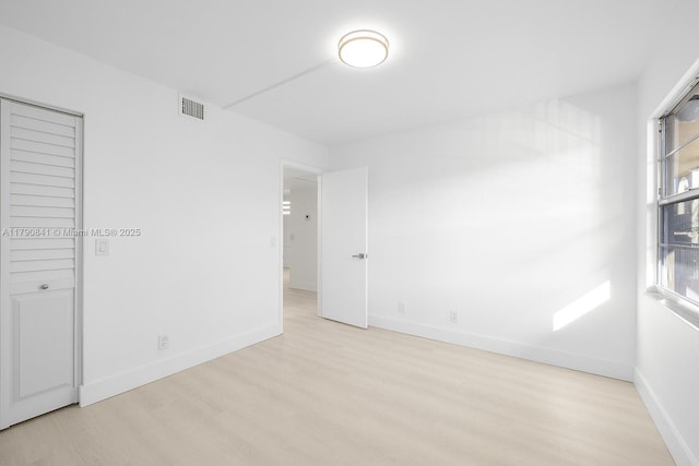 13000 SW 15th Ct Unit 310U, Pembroke Pines, FL 33027 - unfurnished bedroom with baseboards, visible vents, and wood finished floors