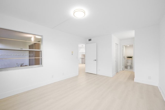 13000 SW 15th Ct Unit 310U, Pembroke Pines, FL 33027 - unfurnished bedroom with ensuite bath, visible vents, wood finished floors, and baseboards