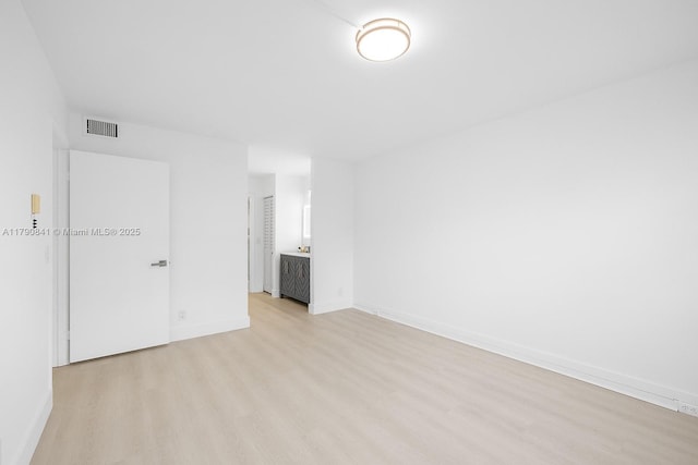 13000 SW 15th Ct Unit 310U, Pembroke Pines, FL 33027 - empty room with baseboards, visible vents, and light wood-style floors