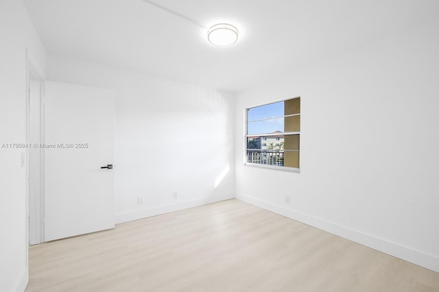 13000 SW 15th Ct Unit 310U, Pembroke Pines, FL 33027 - spare room with baseboards and wood finished floors
