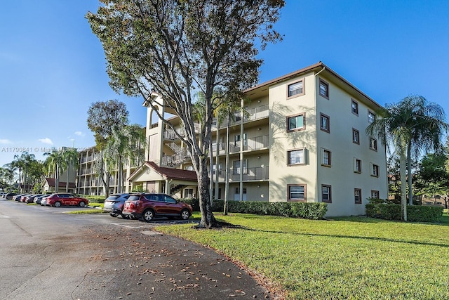 13000 SW 15th Ct Unit 310U, Pembroke Pines, FL 33027 - view of property with uncovered parking