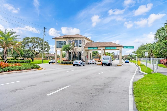 13000 SW 15th Ct Unit 310U, Pembroke Pines, FL 33027 - view of road with street lighting, curbs, and traffic signs