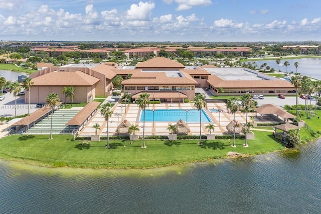 drone / aerial view featuring a residential view and a water view