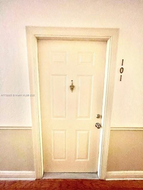 doorway to property with stucco siding