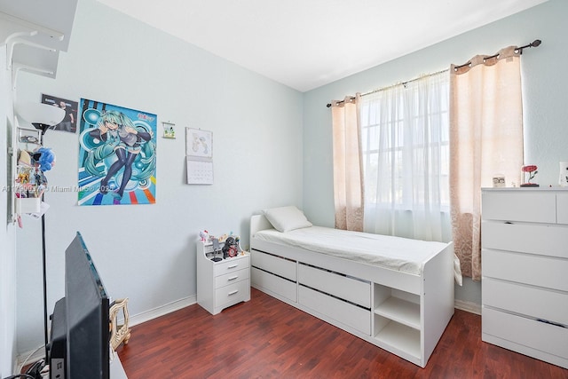 13127 SW 42nd St Unit 6203, Miramar, FL 33027 - bedroom with baseboards and dark wood-type flooring