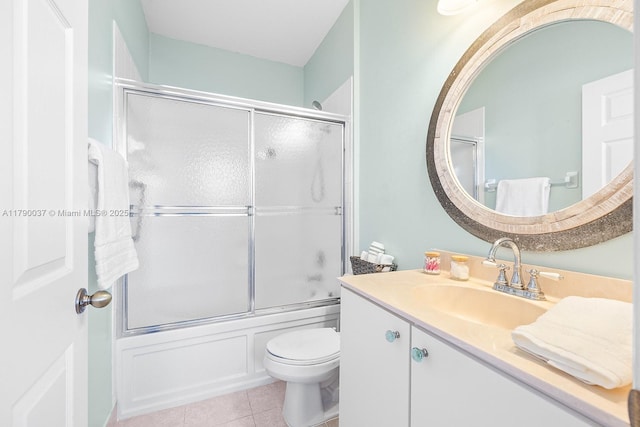 13127 SW 42nd St Unit 6203, Miramar, FL 33027 - bathroom with toilet, tile patterned floors, enclosed tub / shower combo, and vanity