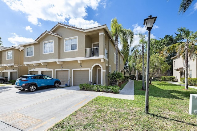 13127 SW 42nd St Unit 6203, Miramar, FL 33027 - multi unit property featuring an attached garage, a front lawn, stucco siding, and driveway