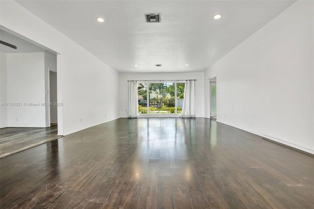 spare room featuring recessed lighting, visible vents, and wood finished floors