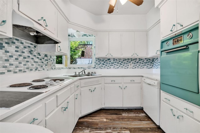 kitchen featuring white cabinets, ceiling fan, a sink, white appliances, and under cabinet range hood