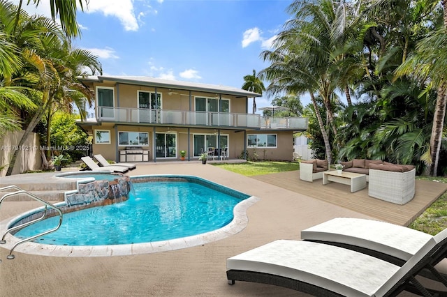 view of swimming pool featuring fence, outdoor lounge area, a fenced in pool, an in ground hot tub, and a patio