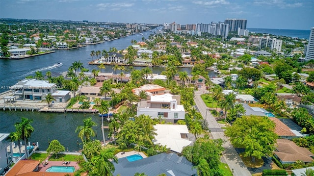 aerial view featuring a city view, a water view, and a residential view