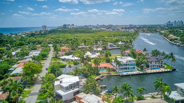 aerial view featuring a water view, a city view, and a residential view