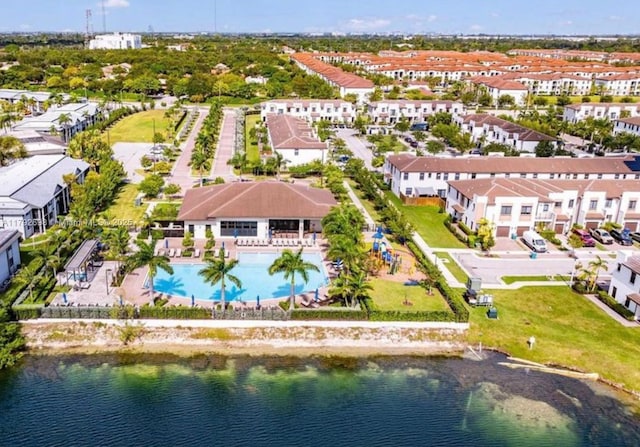 birds eye view of property with a residential view and a water view
