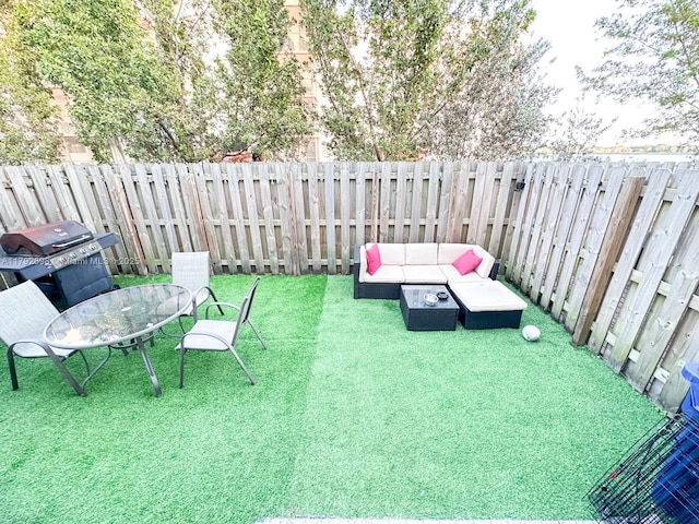 view of yard featuring a fenced backyard and an outdoor hangout area