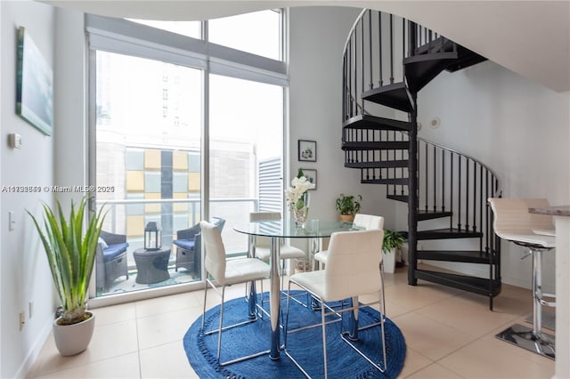 300 S Biscayne Blvd Unit L-432, Miami, FL 33131 - dining area featuring stairs, tile patterned floors, and expansive windows