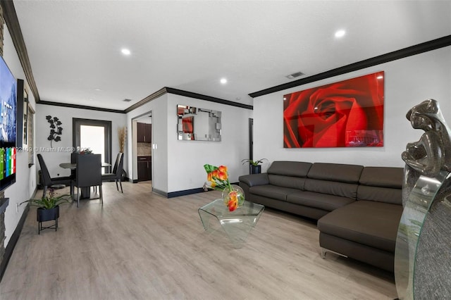 11981 SW 178th Ter, Miami, FL 33177 - living room featuring crown molding, baseboards, visible vents, and wood finished floors