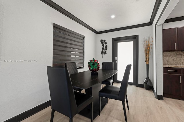 11981 SW 178th Ter, Miami, FL 33177 - dining space featuring light wood-type flooring, baseboards, and crown molding
