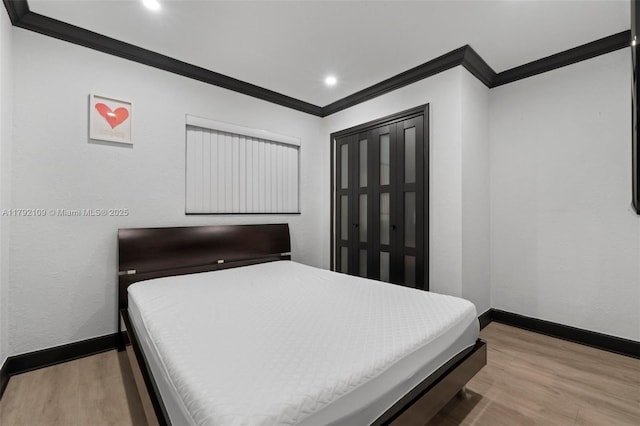 11981 SW 178th Ter, Miami, FL 33177 - bedroom featuring baseboards, ornamental molding, and light wood finished floors