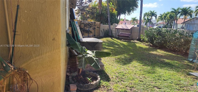 view of yard with a fenced backyard and a residential view