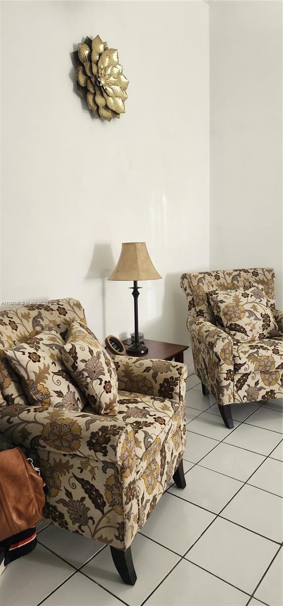bedroom featuring light tile patterned floors
