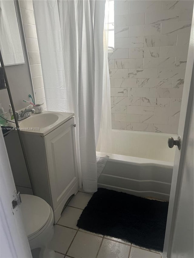 full bath featuring vanity, tile patterned floors, toilet, and shower / tub combo with curtain