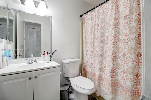 full bathroom with vanity, a shower with curtain, and toilet