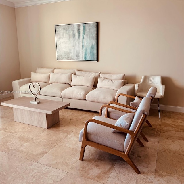 living area featuring crown molding and baseboards