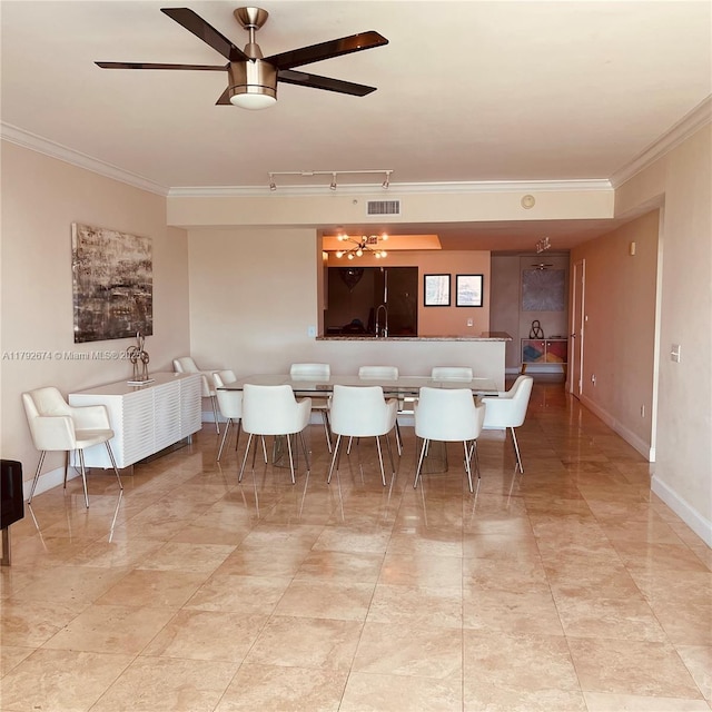 dining area featuring crown molding, baseboards, ceiling fan, and visible vents
