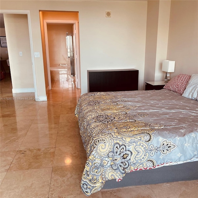 bedroom featuring baseboards