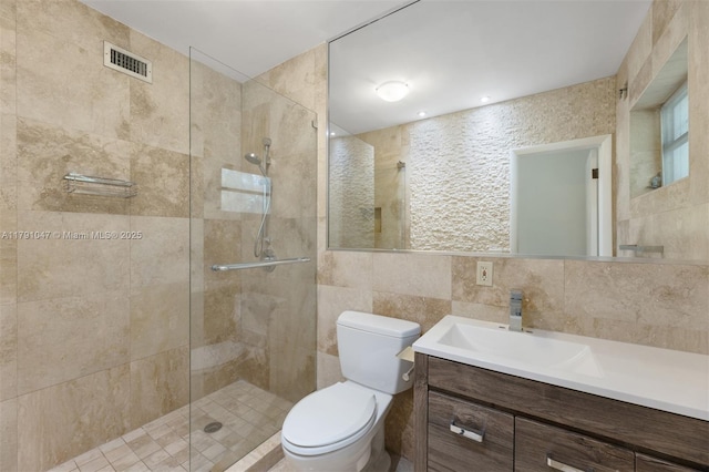 7920 SW 132nd St, Pinecrest, FL 33156 - bathroom with visible vents, vanity, toilet, tile walls, and tiled shower
