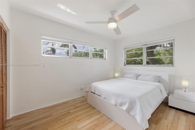 7920 SW 132nd St, Pinecrest, FL 33156 - bedroom with ceiling fan, light wood finished floors, and a closet