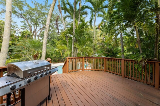 7920 SW 132nd St, Pinecrest, FL 33156 - wooden deck featuring a grill