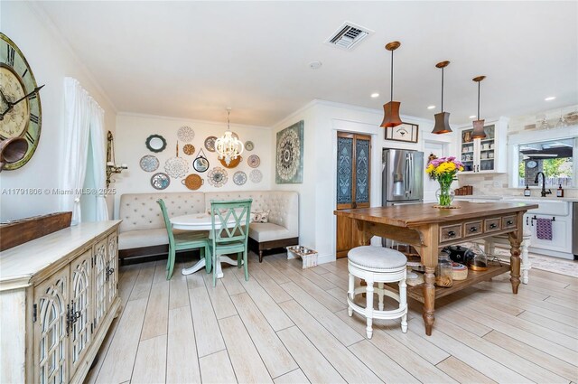 18525 SW 90th Ct, Cutler Bay, FL 33157 - kitchen with stainless steel fridge with ice dispenser, visible vents, light wood-style flooring, and breakfast area
